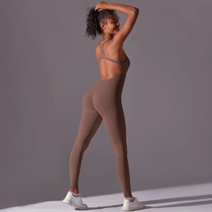 Detail of coffee brown seamless yoga jumpsuit with cross straps and ribbed texture