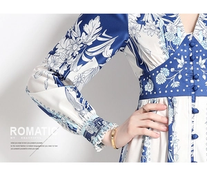 Detail view of vintage blue floral dress showing V-neckline and elegant single-breasted buttons