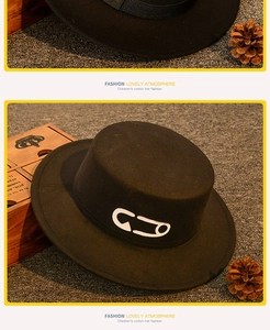 Close-up of children black cotton flat top hat with stylish white safety pin pattern