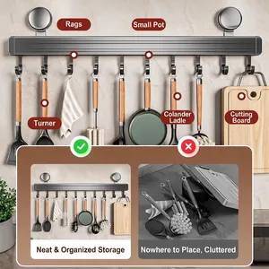 Space aluminum kitchen rail with suction cups holding spatulas and pans on wall