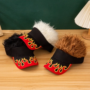 Detailed view of wig visor hats with flame embroidery in black, white, and brown hair