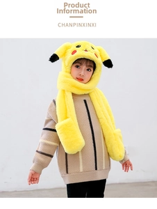 Close-up of yellow plush Pikachu hat with scarf and mittens for children