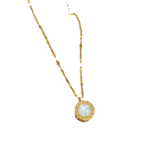 Golden titanium steel necklace with a Roman numeral clock pendant and white mother of pearl