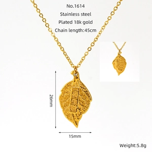 Detail view of gold leaf pendant necklace with size dimensions in stainless steel