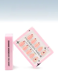 Close-up of pink French press-on nails with strawberry patterns in a 30-piece box