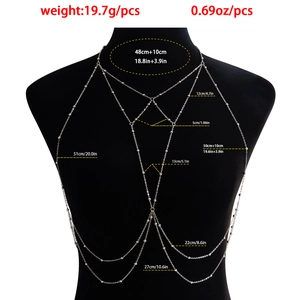 Silver bead body chain with layered diamond pendant and fringe detail on black mannequin