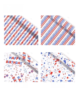 Macro view of four red and blue gift wrapping paper patterns with birthday and star designs