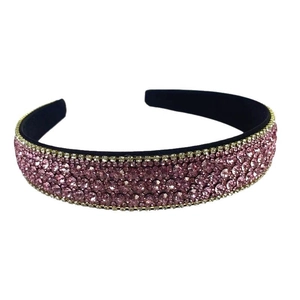 Sparkling pink rhinestone headband with black velvet lining for a luxurious hair accessory