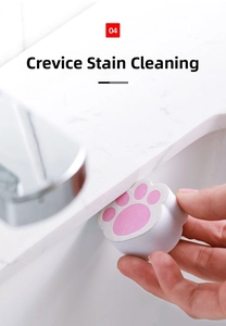 Close-up of cat paw sponge cleaning bathroom sink crevices and removing stubborn stains