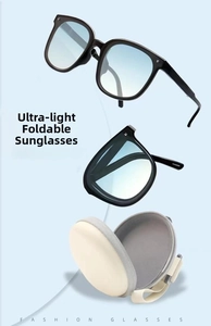 Modern foldable sunglasses with black frames, blue gradient lenses and a beige case