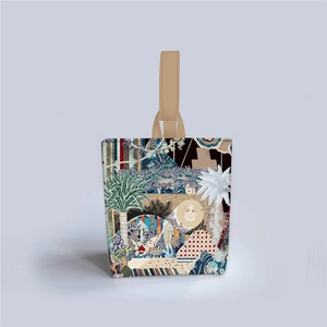 Detail of canvas bucket bag with starry forest illustration and beige handles