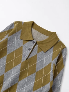 Close-up of olive and grey argyle knit polo shirt detailing the collar and buttons