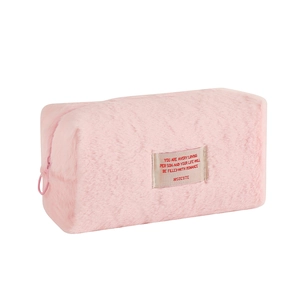 Pink plush octagonal makeup bag with soft fleece texture and romantic quote patch