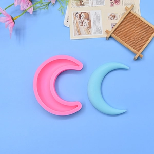 Detailed pink crescent moon silicone mold with light blue finished cake decoration