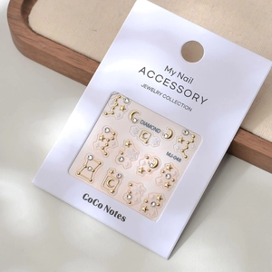 Detailed close-up of MJ-048 constellation nail stickers with golden moon and star relief