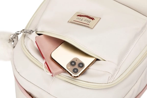 Front zipper pocket detail showing spacious storage with notebook and smartphone