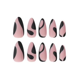 Matte almond press-on nails in pale pink with black abstract swirls and wavy patterns
