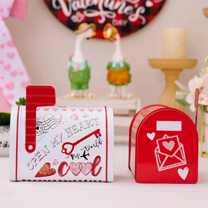 Close-up of red and white Valentine mailbox tin boxes for gifts and candy storage
