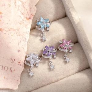 Star-shaped planet earrings with zircons in blue, white, purple and pink colors