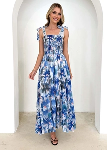 Detail of blue floral maxi dress with smocked bodice and lace-up shoulder straps