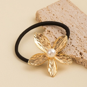 Minimalist gold cross textured flower hair tie with pearl center and elastic band