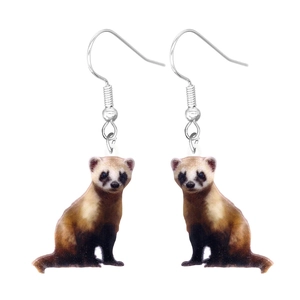 Detail of acrylic drop earrings featuring cute realistic brown weasel animal pendants