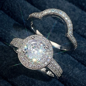 Sparkling silver halo ring set with cubic zirconia diamonds in a blue velvet gift box