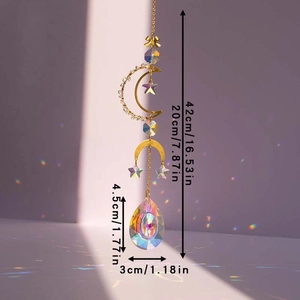 Detailed view of moon suncatcher casting rainbow light spots on wall via crystal prism