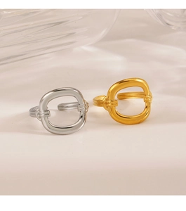 Detail of gold and silver hollow geometric rings with fine textured bands on the metal