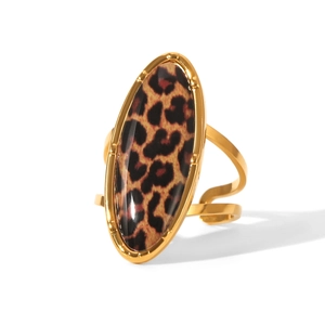 Detail of gold oval ring featuring a bold leopard print inlay and adjustable open band