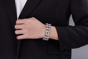 Men's hip hop 22mm bicycle chain bracelet in polished stainless steel worn with a suit