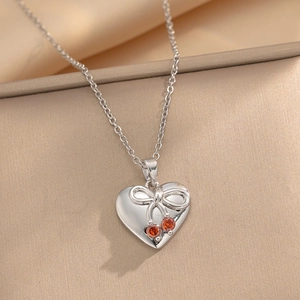 Silver titanium steel heart necklace with bow knot and red cherry zircon pendants