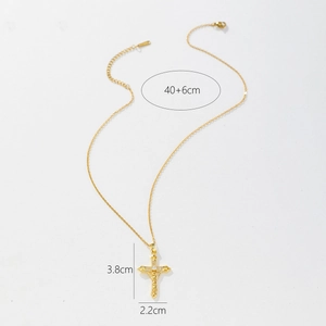 Detailed view of gold cross pendant with dimensions 3.8cm x 2.2cm and 40+6cm chain