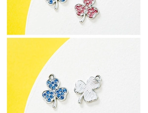Detailed front and textured back view of clover pendants with blue and pink rhinestones