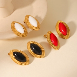 Detail of vintage marquise resin earrings with twisted gold stainless steel base