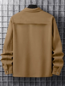 Rear view of khaki corduroy jacket showing yoke stitching and metal buttoned cuffs