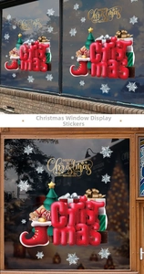 Detail of red Christmas sock stickers and festive ornaments on glass shop windows