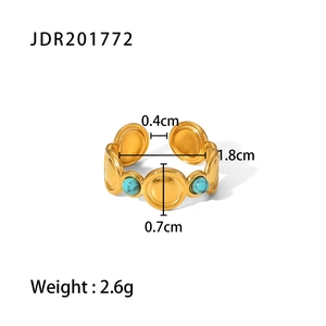 Close-up of gold turquoise open ring showing intricate circle details and size metrics
