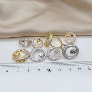 Macro detail of S925 silver pearl settings with cubic zirconia and size scale