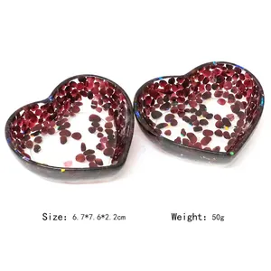 Two heart-shaped resin jewelry dishes with red crystals and glitter, 6.7x7.6x2.2cm size