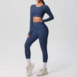 Detail view of high-waist yoga leggings with side pockets and brushed fabric texture