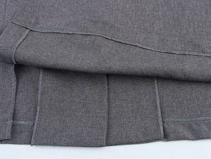 Close-up of grey blazer inner lining and high-quality stitching details for formal wear