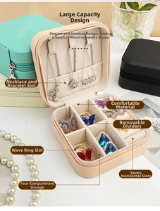 Macro detail of portable PU jewelry box showing necklace hooks and ring slots