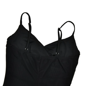 Detail of black V-neck camisole with adjustable spaghetti straps and cross design