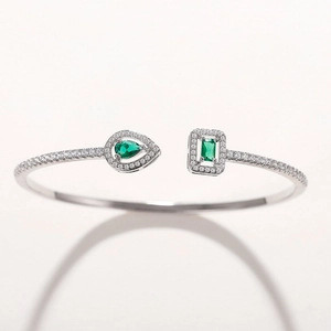 Silver open adjustable cuff bracelet with green teardrop and rectangle zircon stones