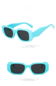Detailed views of apple green rectangular chunky sunglasses with geometric faceted frames
