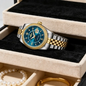 Luxury men's two-tone steel watch with blue roman dial inside a black velvet box