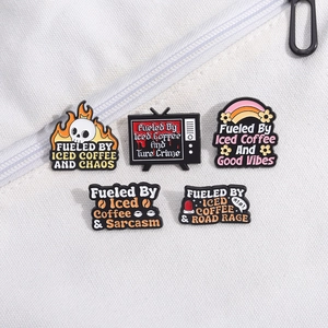 Set of 5 enamel pins featuring creative iced coffee quotes on white background