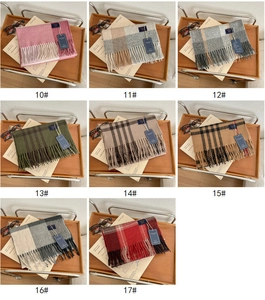Grid display of checkered scarves in 8 colors with fringe and wooden tray decor