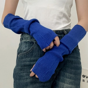 Detail of Klein blue knitted long fingerless arm sleeves with ribbed texture and stretch